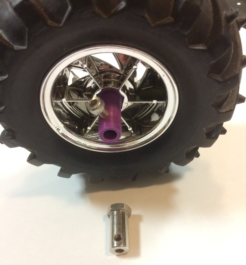 The new 3D printed hub attached to the wheel with the old one for comparison.